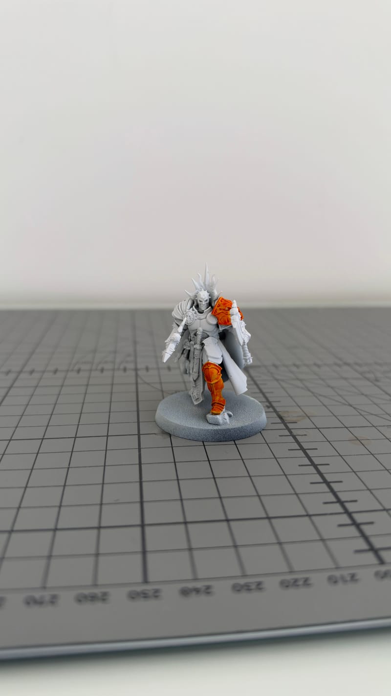 The Reclusian part-painted: orange started on one side, the rest still white.